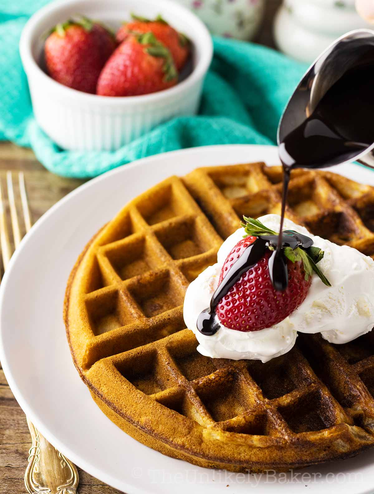 Strawberry Waffles with Whipped Cream, Fresh Strawberries and Chocolate Syrup