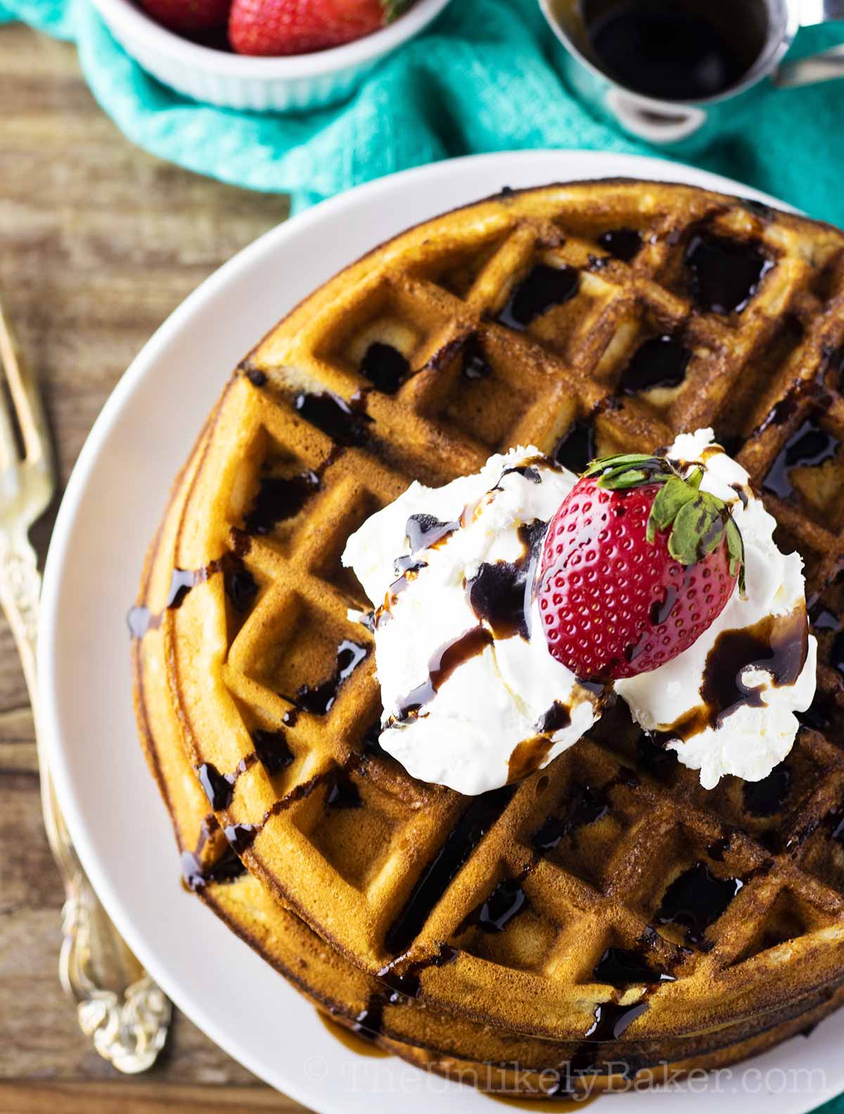 Strawberry Waffles with Whipped Cream, Fresh Strawberries and Chocolate Syrup