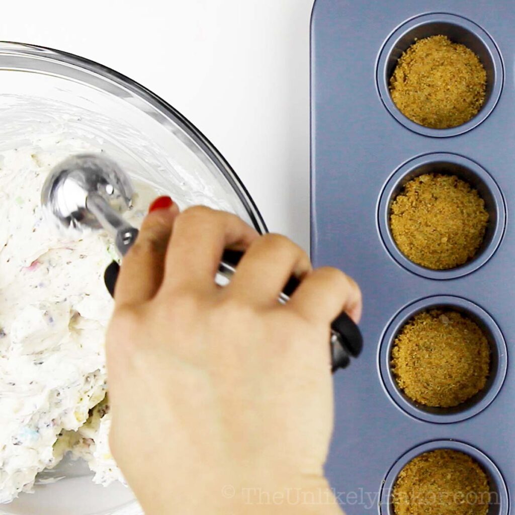 Scoop cheesecake batter to pan.
