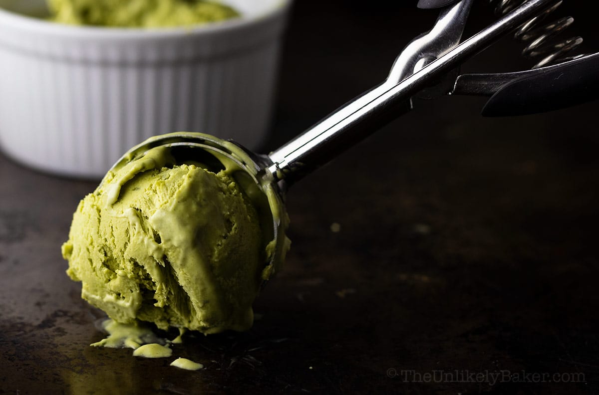 A scoop of Matcha Ice Cream on a dark background.