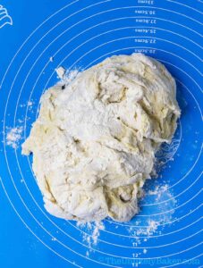 Ube buns dough on a pastry mat.