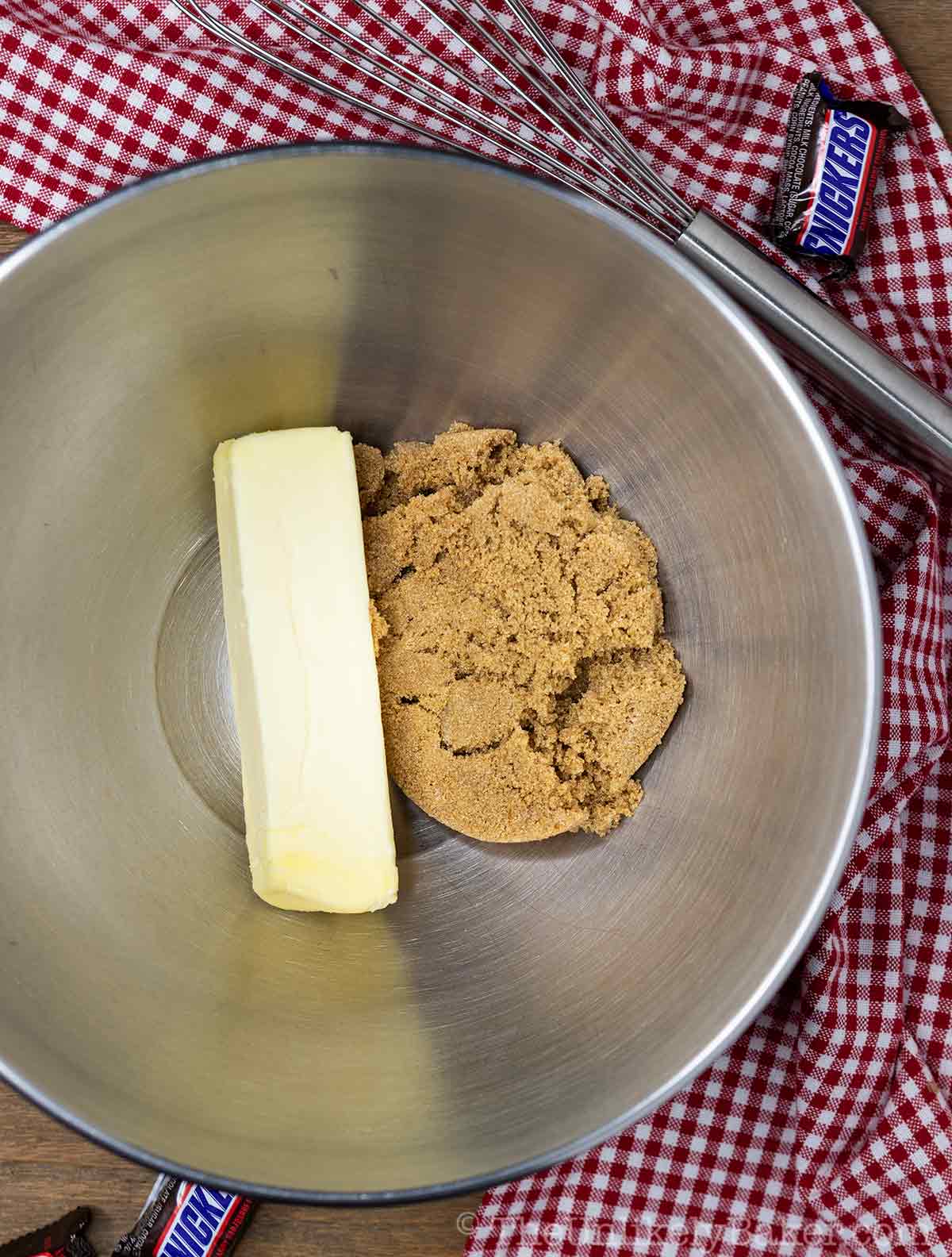 Butter and brown sugar in a bowl.