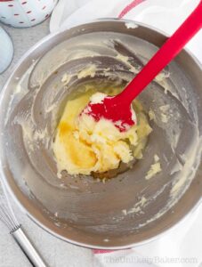 Butter, sugar, vanilla and egg whites in a mixing bowl