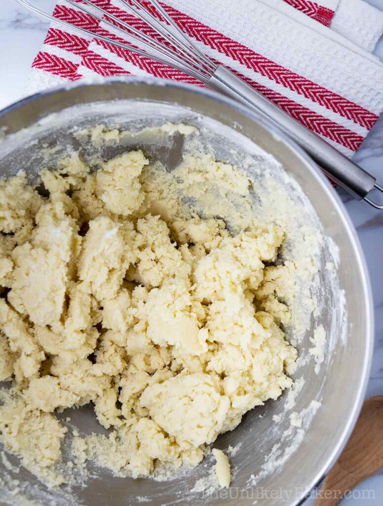 Buttery shortbread cookie dough in mixing bowl