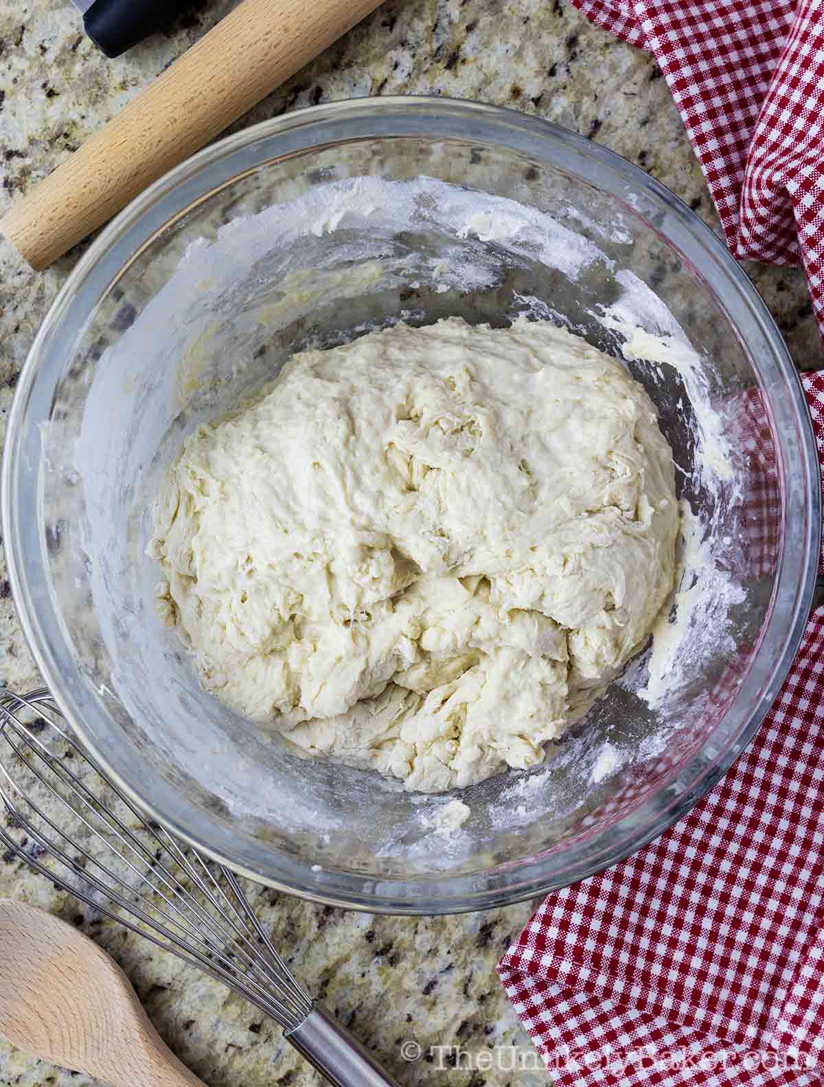 Dough combined until it started pulling together in a ball.