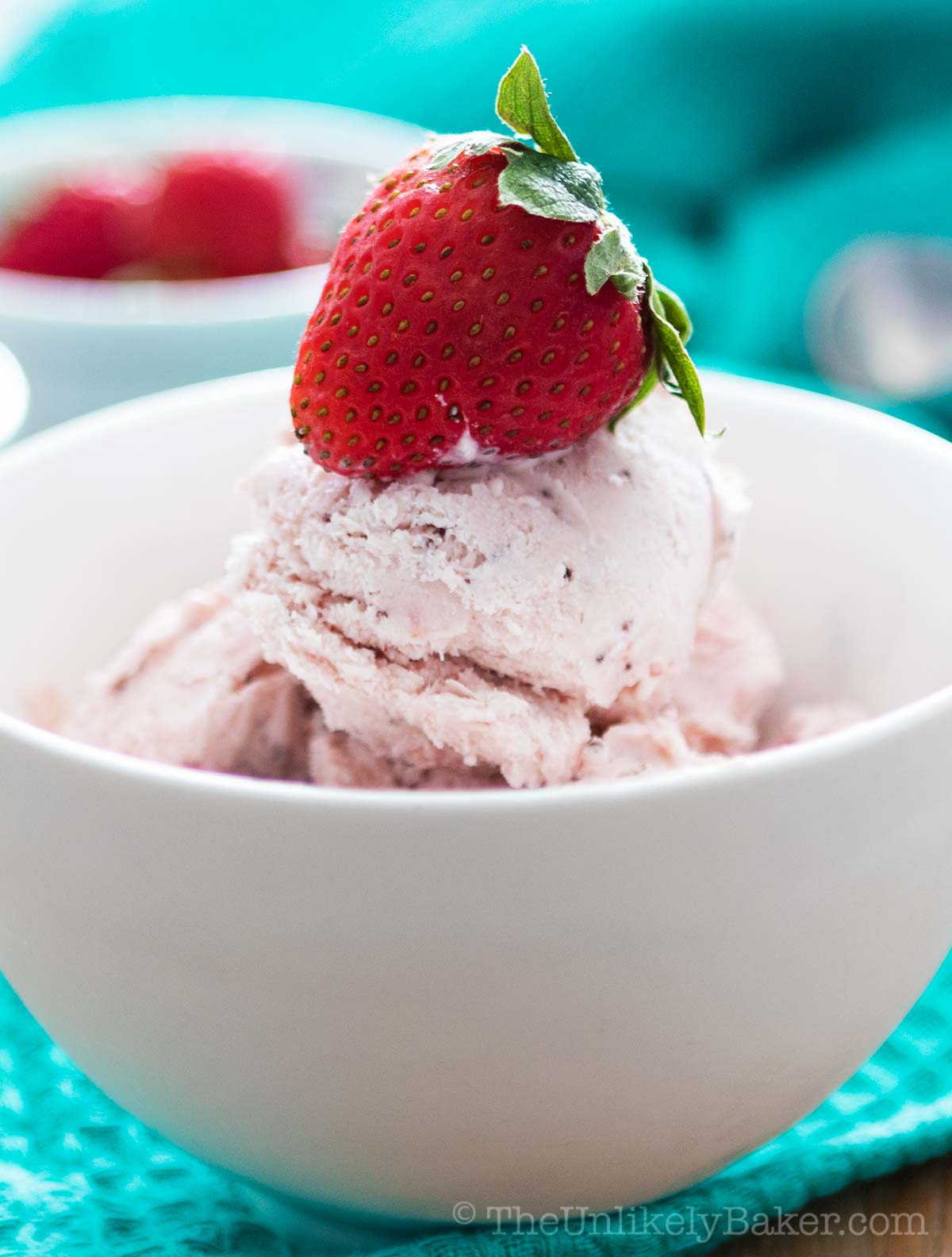 Strawberry chocolate chip ice cream in a bowl.