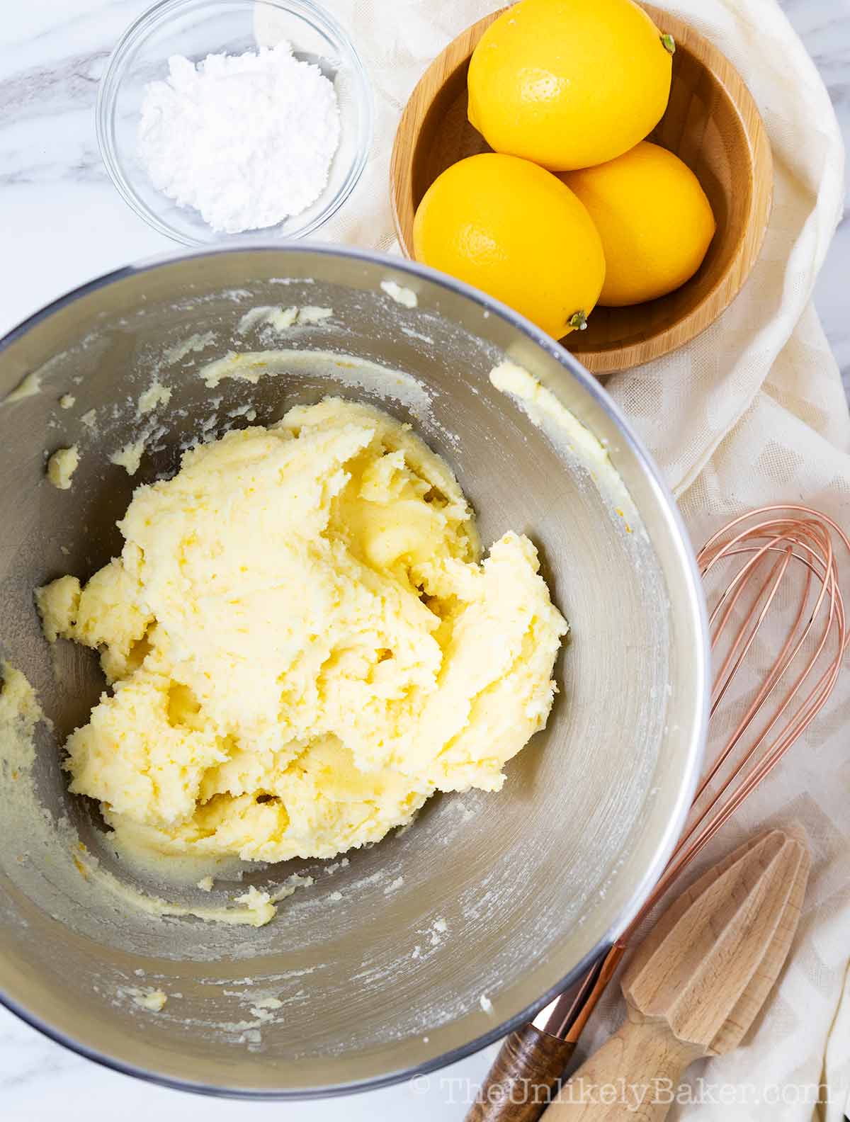 creamed butter and lemon sugar in a mixing bowl