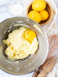 creamed butter with egg in a bowl
