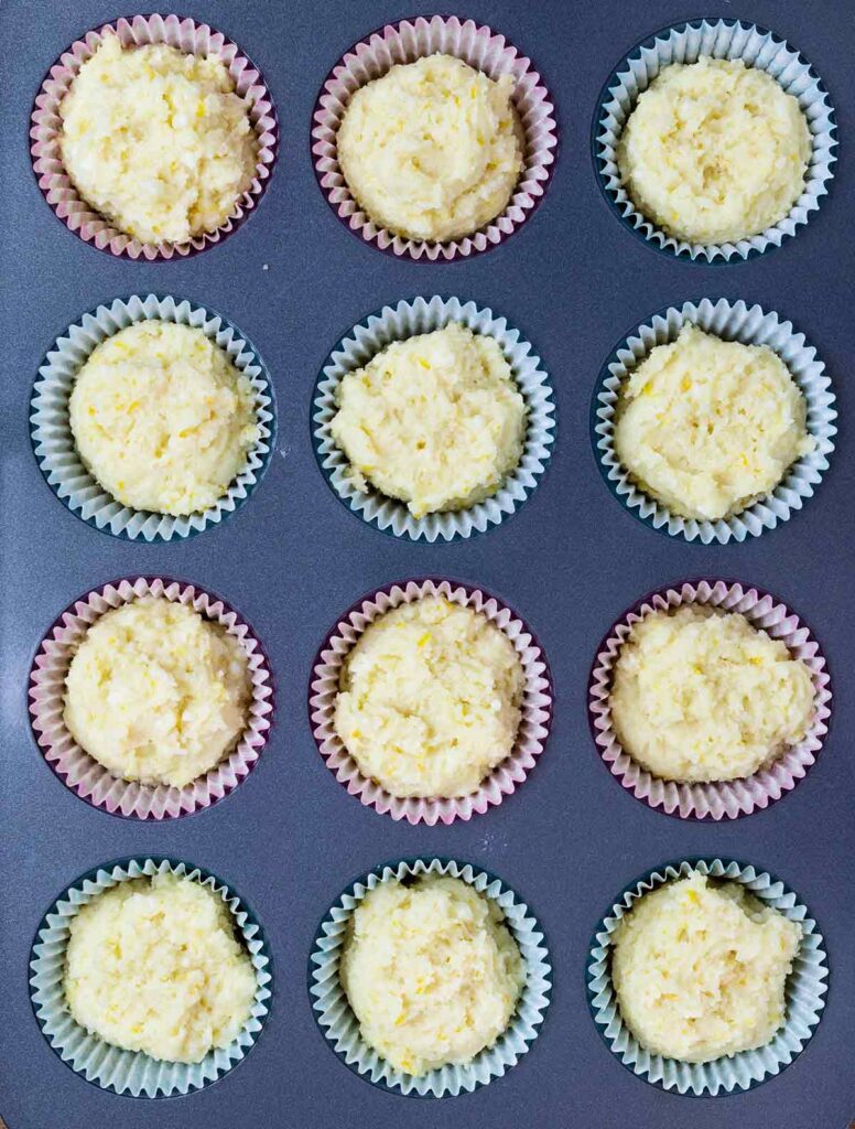 lemon ricotta muffins batter on muffin pan