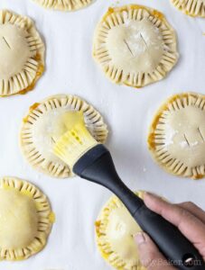 Hand pies brushed with egg wash.