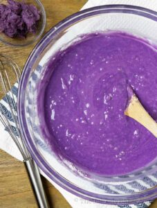 ube muffins batter in a bowl