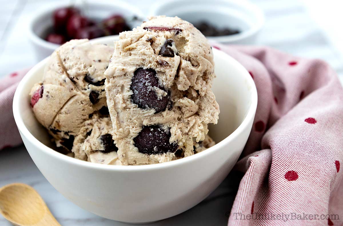 Scoop of cherry chip ice cream in a bowl.