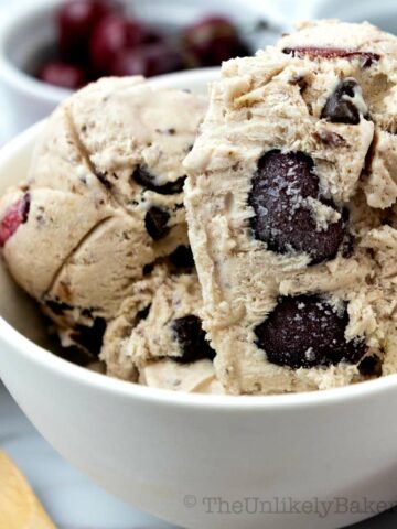 Scoop of cherry chocolate chip ice cream in a bowl.
