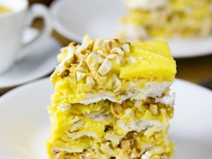 Slice of sans rival cake on a plate.