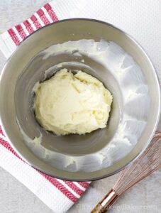 Beat mascarpone cheese with sugar until smooth
