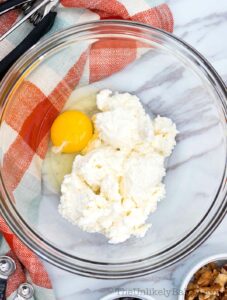 Combine ricotta cheese and eggs