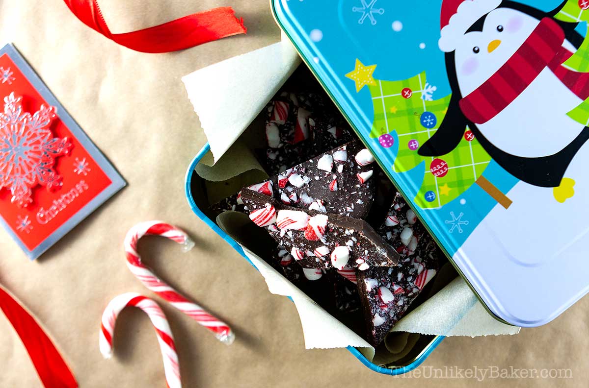 Homemade chocolate bark in a Christmas tin