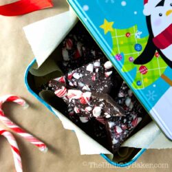 Homemade chocolate bark in a Christmas tin