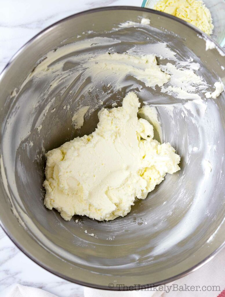 Cream cheese and butter combined in a bowl