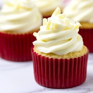 Close up shot of white chocolate cupcake with raspberry filling