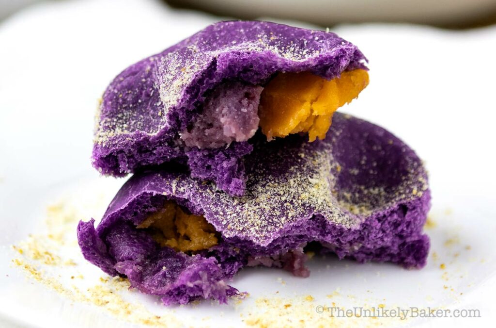 Photo of ube pandesal filled with cheese and ube jam.