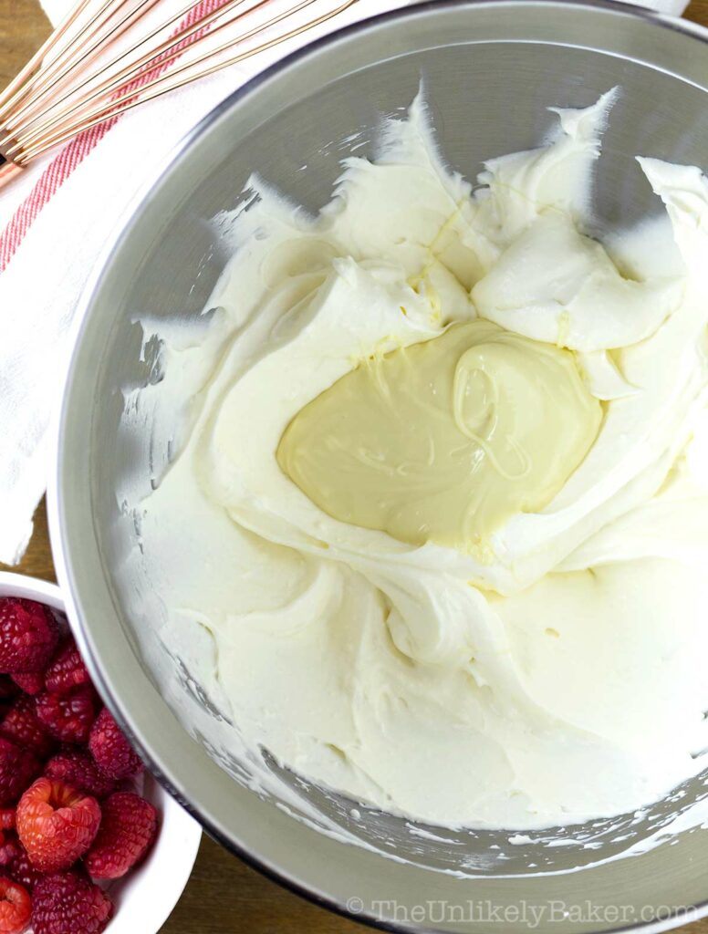 melted white chocolate over mascarpone and whipped cream