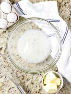Frothy egg whites in a bowl.