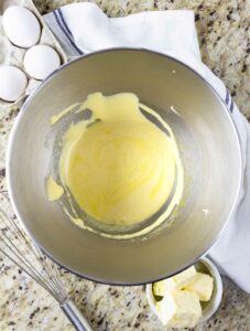 Sugar added to egg yolk mixture.