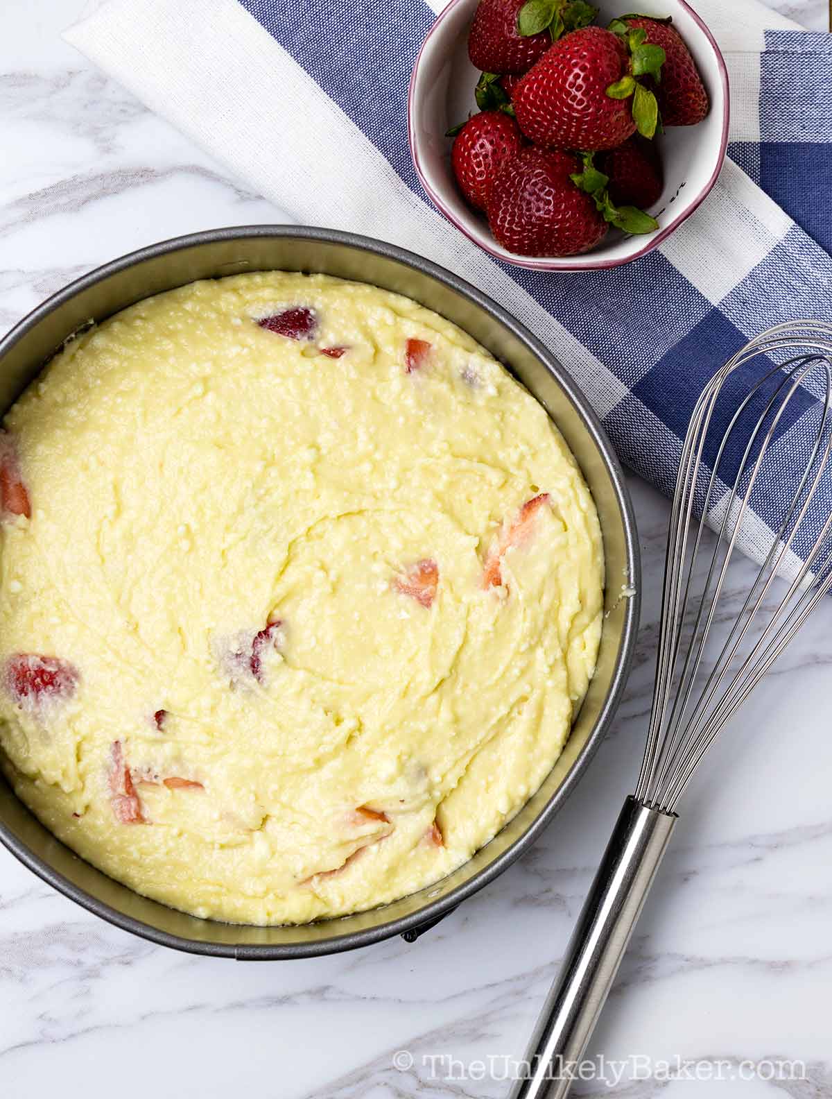 Cake batter in a pan ready to go into oven.