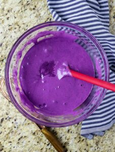 Purple cake batter in a bowl.