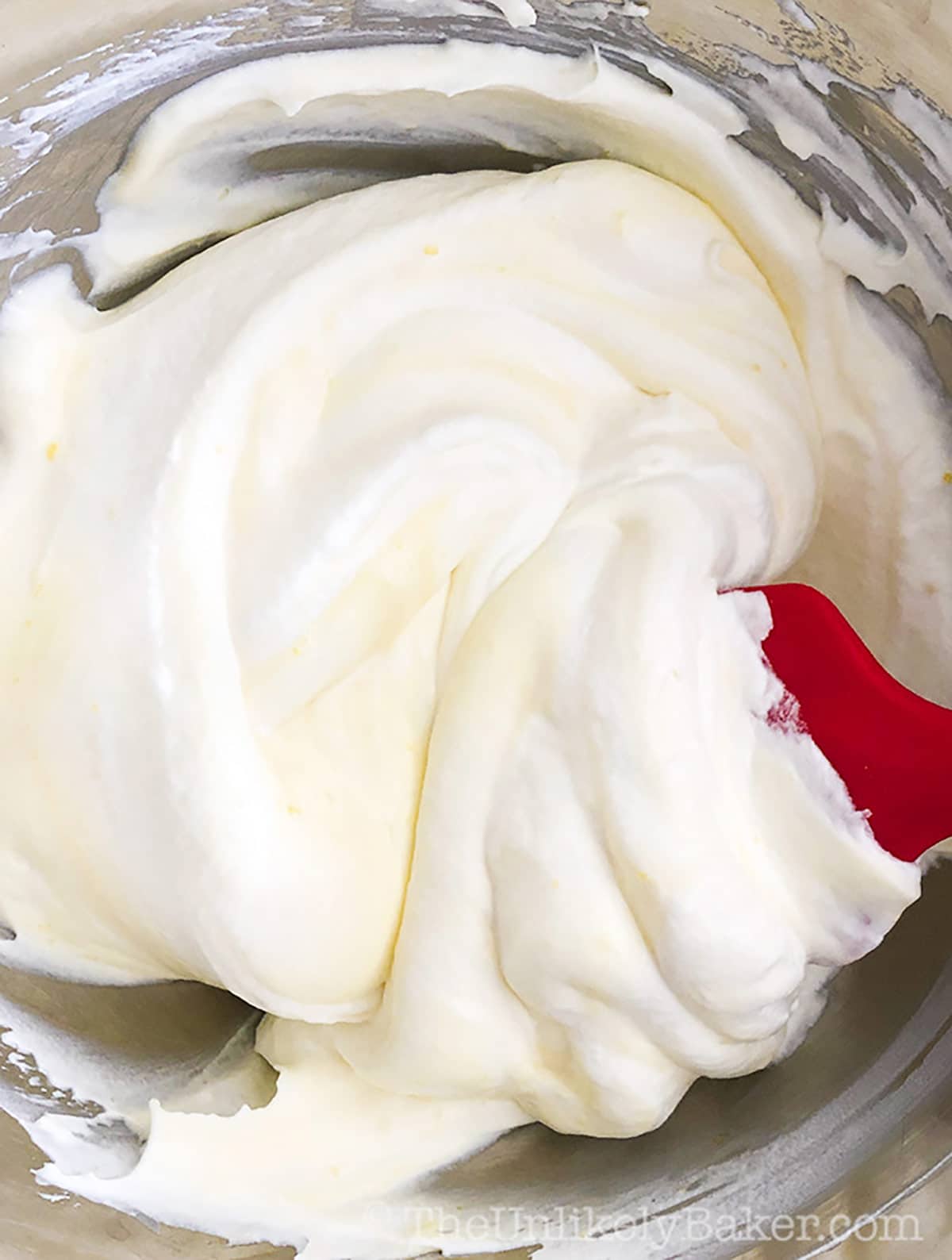 Recipe step - whipped cream folded into ice cream base.