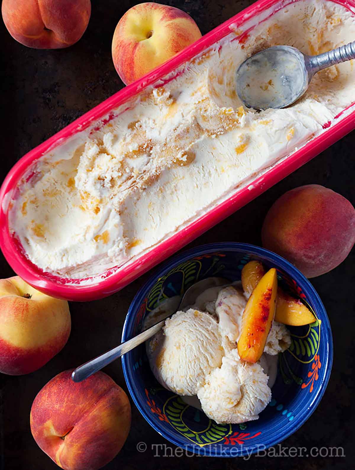 No churn peach ice cream in a tub.