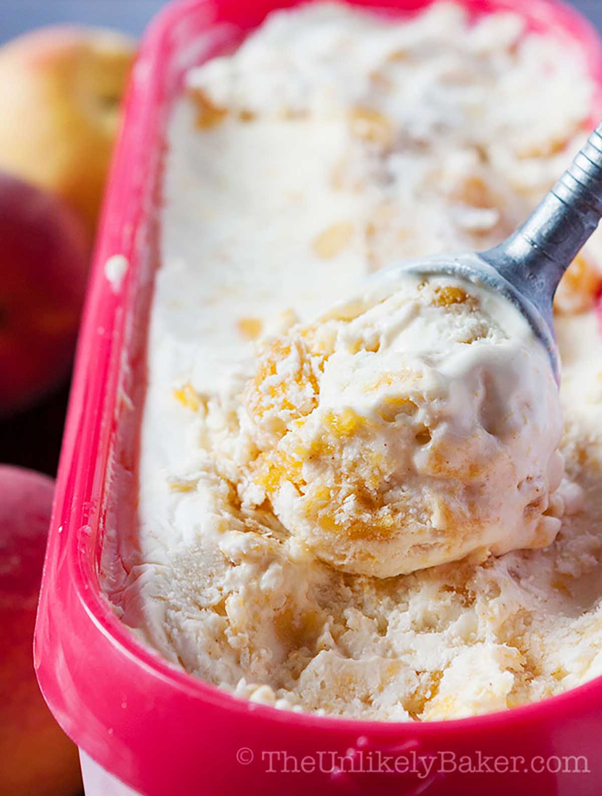 A scoop of peaches and cream ice cream.