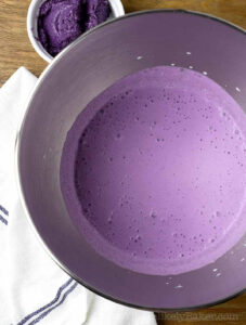 Ube cream mixture in a bowl.