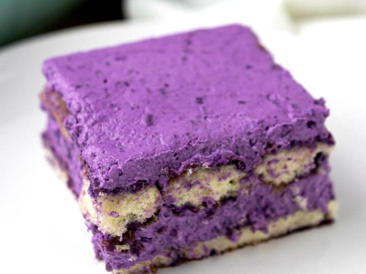 A slice of ube tiramisu on a plate.