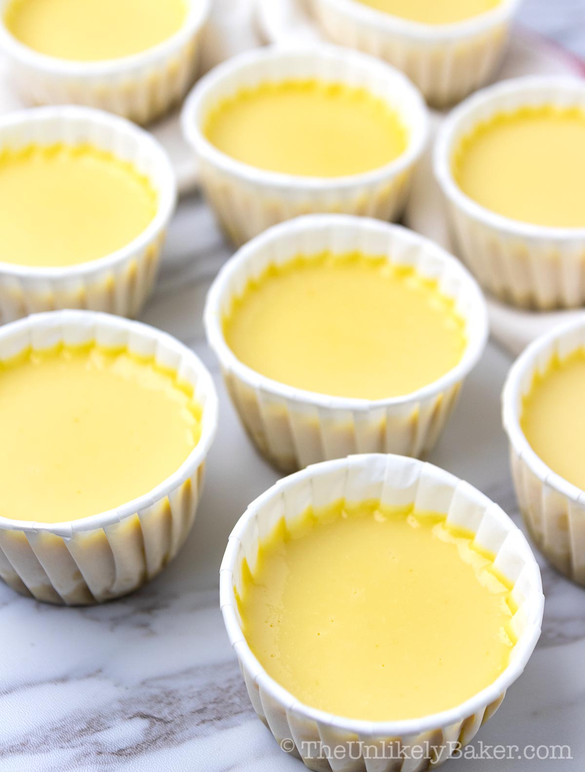 Smooth and creamy flan in cupcake cups.