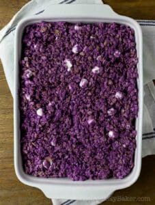 Ube rice krispies in a baking dish.