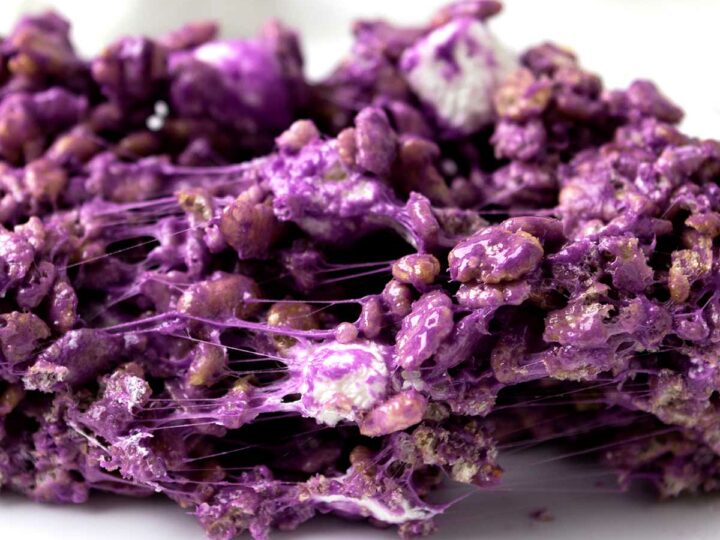 Chewy ube rice krispies on a plate.
