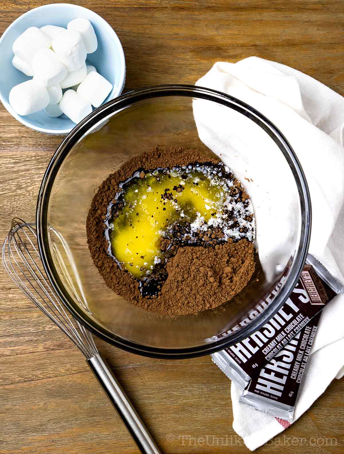 Melted butter and cocoa powder in a bowl.