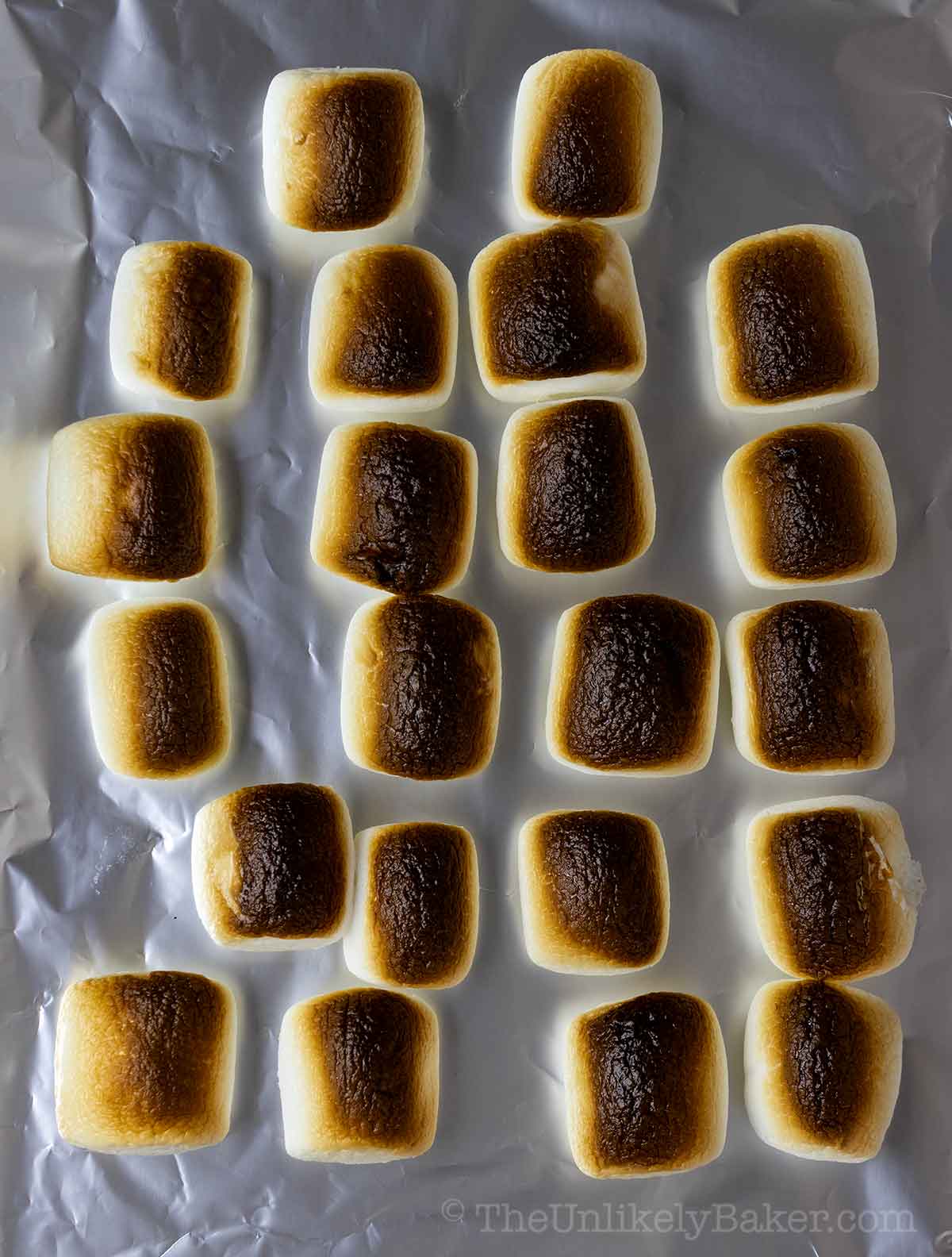 Toasted marshmallows on a pan.