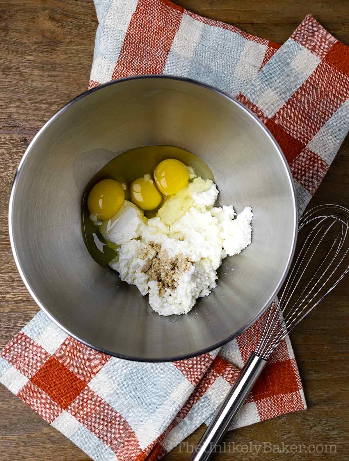 Eggs and ricotta cheese in a bowl.