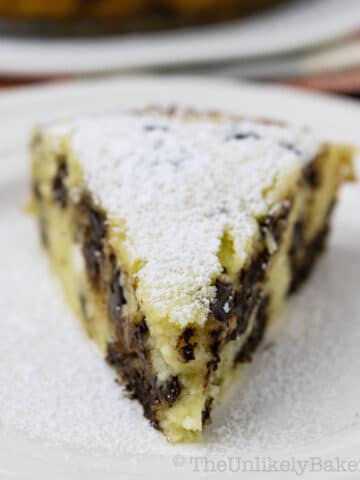 A slice of chocolate ricotta cake on a plate.