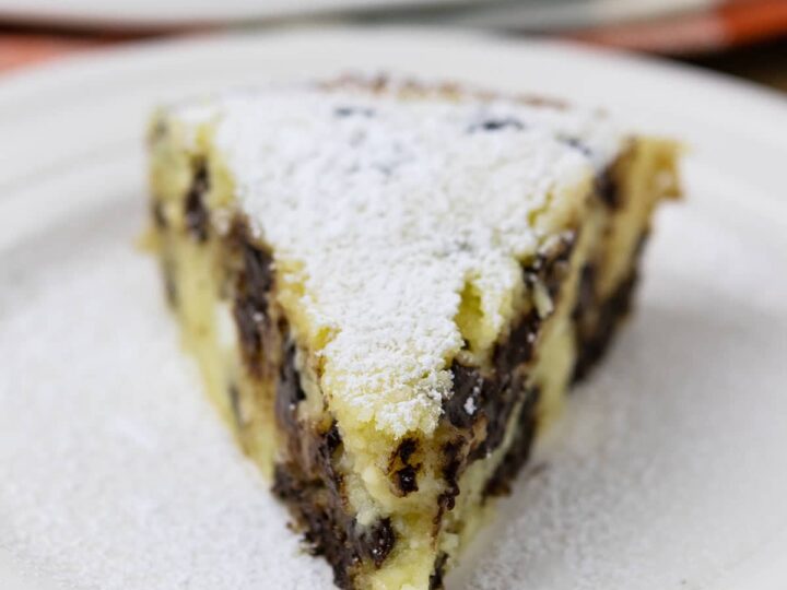 A slice of chocolate ricotta cake on a plate.