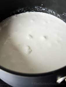Glutinous rice and coconut milk in a pot.
