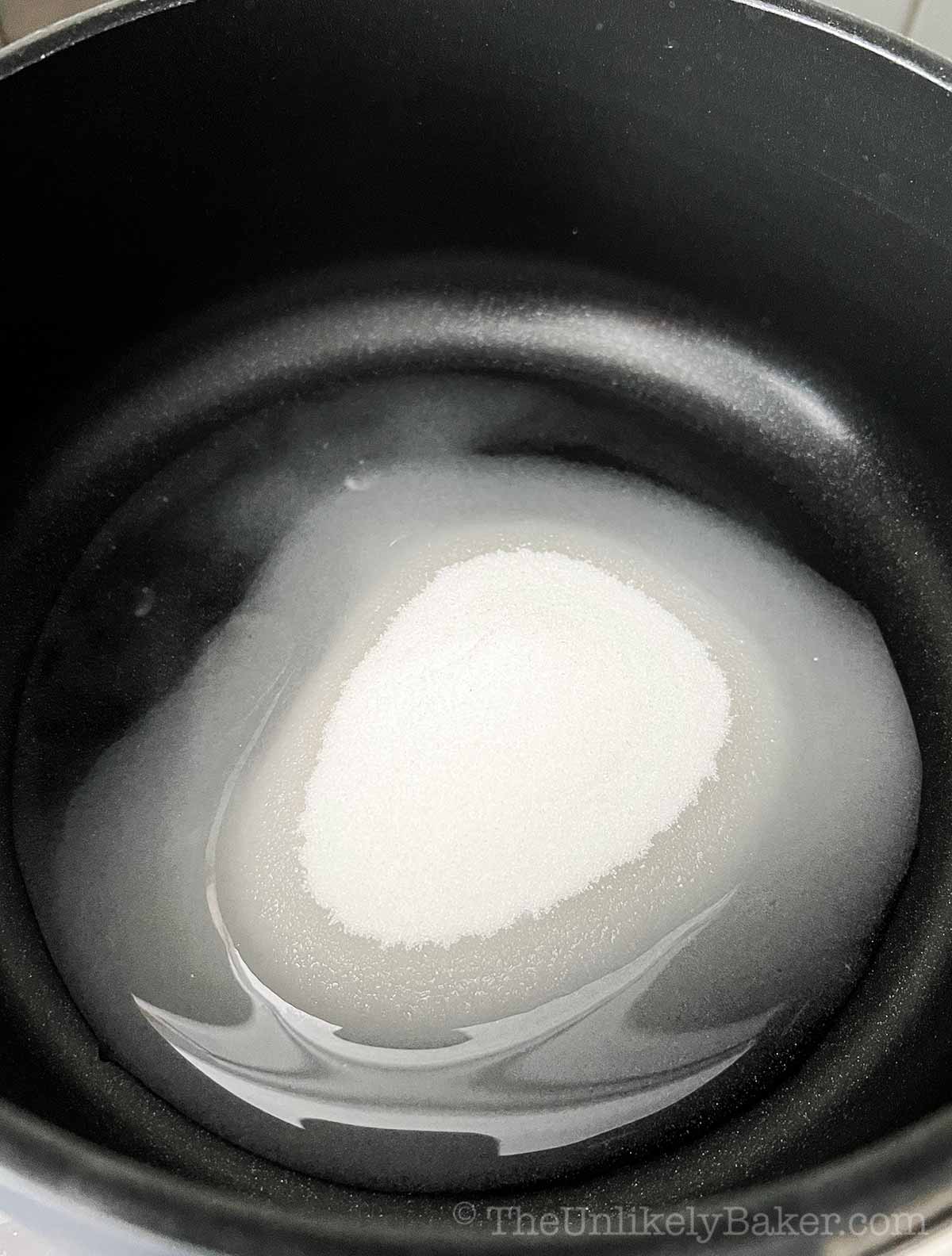Sugar and water in a pot.