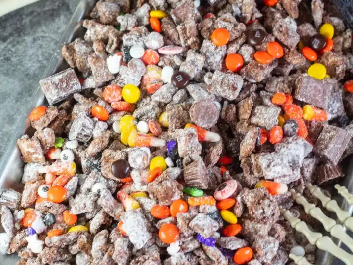 Halloween muddy buddies made with candy from Halloween.