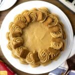 Delicious Biscoff cake topped with Biscoff biscuits on a serving platter.