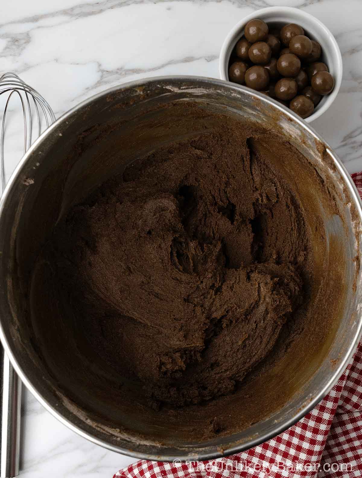 Chocolate cookie dough in a bowl.