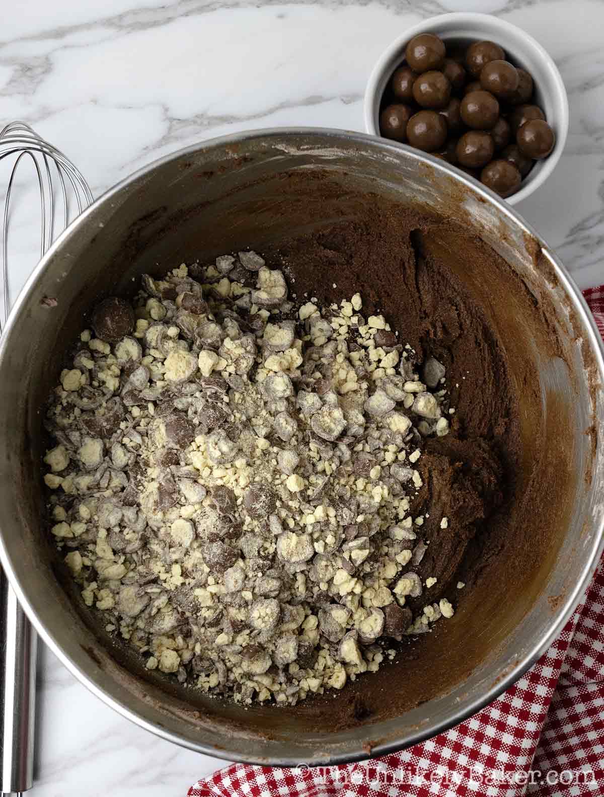 Cookie dough with chopped Maltesers in a bowl.