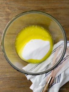 Melted butter and sugar in a bowl.